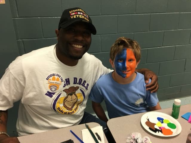 Dad volunteering on a school campus