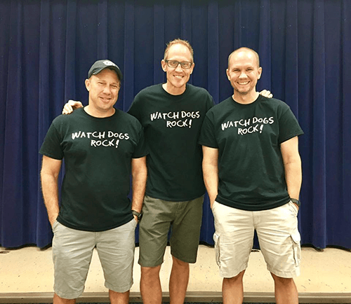 Father volunteer engaging with students