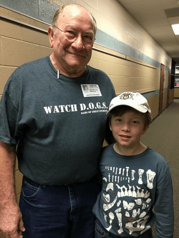 Volunteer father in school hallway